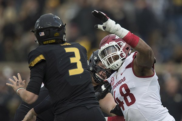 Arkansas defensive end Deatrich Wise pressures Missouri quarterback Drew Lock during a game Friday, Nov. 25, 2016, in Columbia, Mo. 