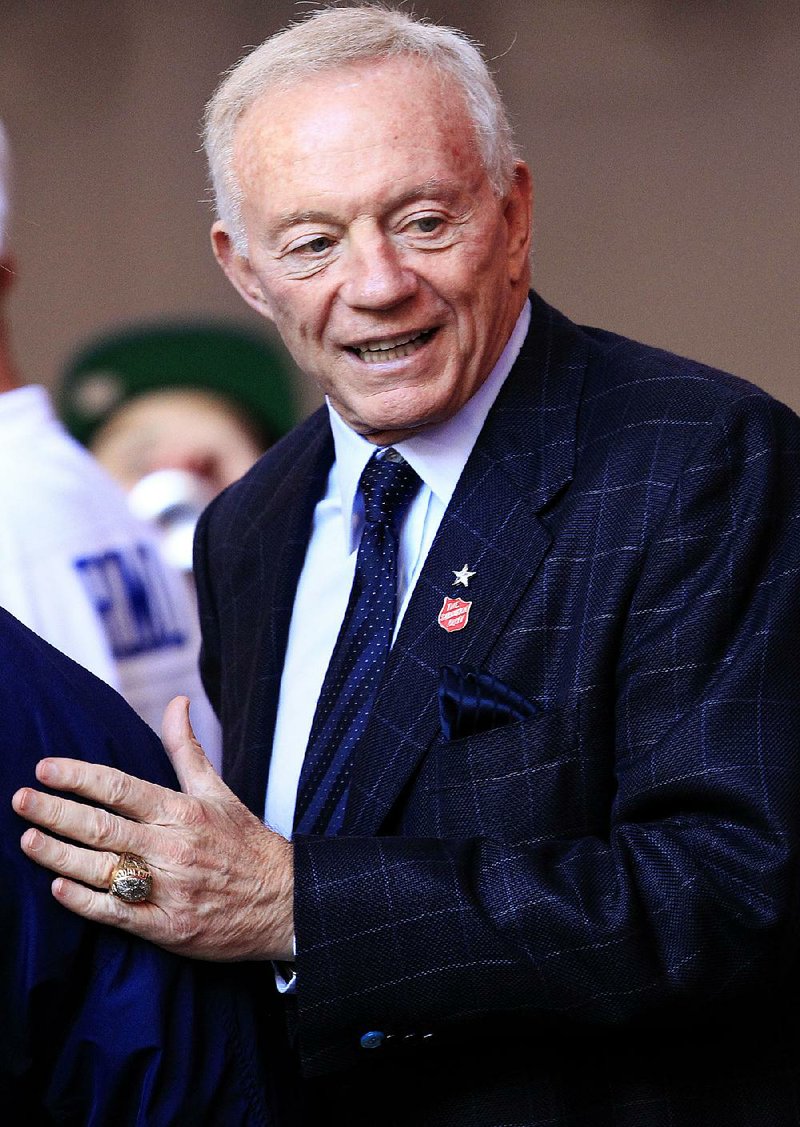 Dallas Cowboys owner Jerry Jones talks with Cowboys fans prior to an NFL football game against the Arizona Cardinals Sunday, Dec. 4, 2011, in Glendale, Ariz.