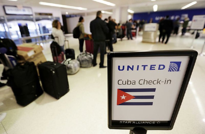 Passengers wait to check in Tuesday for United Flight 1502, the first direct passenger flight from Newark Liberty International Airport to Havana.