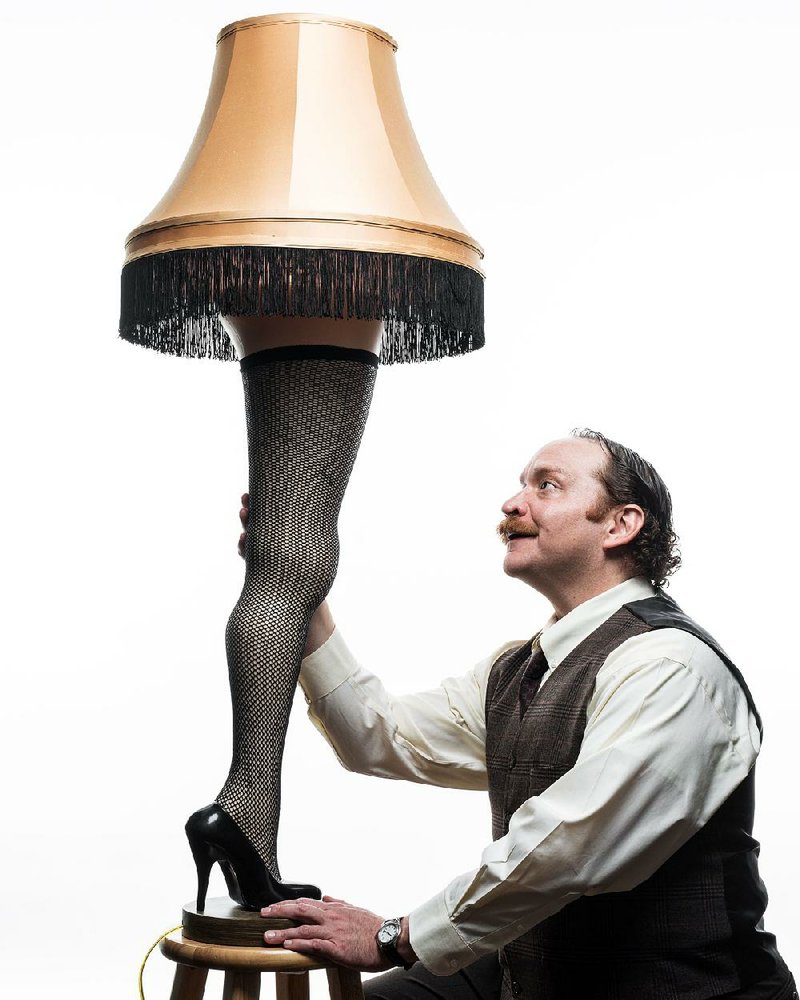 Justin R.G. Holcomb, as Ralphie’s Old Man, admires the infamous leg lamp in the Rep’s A Christmas Story.