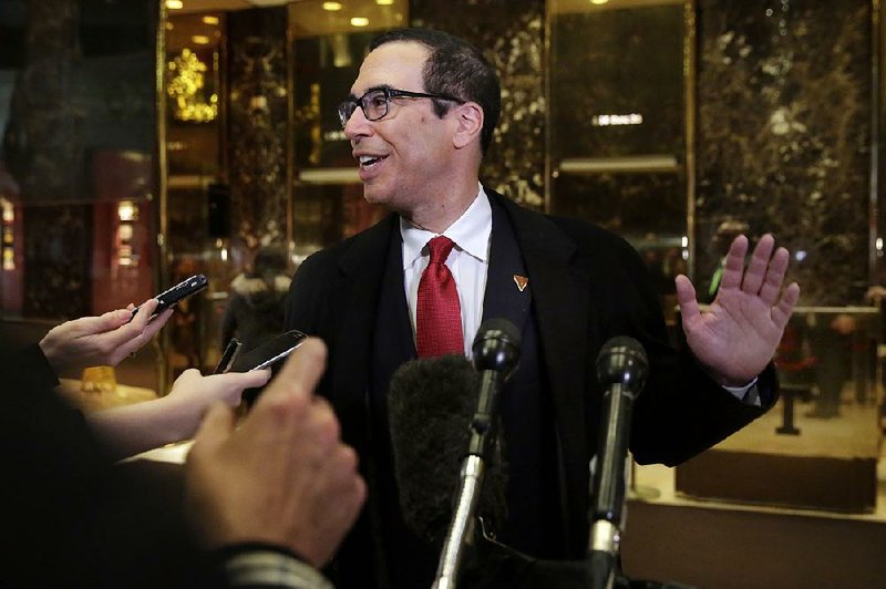 Former Goldman Sachs executive Steven Mnuchin arrives at Trump Tower in New York on Wednesday. Mnuchin was formally announced as President-elect Donald Trump’s choice for treasury secretary.