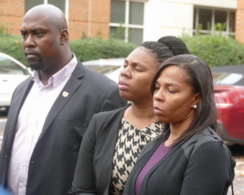 The family of Keith Lamont Scott including his wife Rakeyia Scott, right, attend a news conference after finding out charges would not be filed against CMPD officer Brentley Vinson in the fatal shooting of her husband. District Attorney Andrew Murray announced that the shooting by officer Brent Vinson was justified. Vinson, who is black, shot and killed Keith Lamont Scott on Sept. 20. 