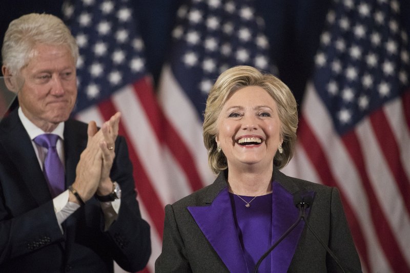 In this Wednesday, Nov. 9, 2016 file photo, former President Bill Clinton applauds as his wife, Democratic presidential candidate Hillary Clinton speaks in New York, where she conceded her defeat to Republican Donald Trump after the hard-fought presidential election. Hillary Clinton's aides and supporters are urging dispirited Democrats to channel their frustrations about the election results into political causes - just not into efforts to recount ballots in three battleground states.