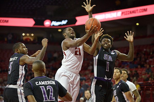 Arkansas' Manny Watkins drives for a shot during a game against Stephen F. Austin on Thursday, Dec. 1, 2016, in Fayetteville. 