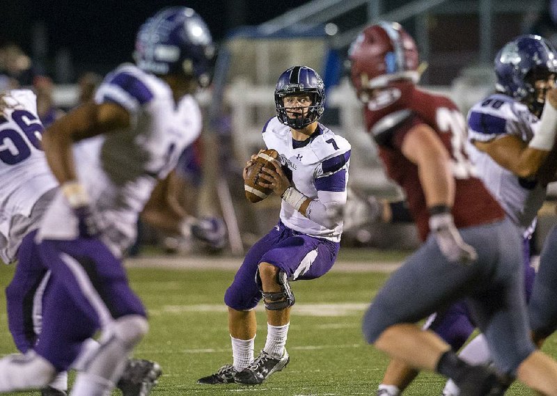 Fayetteville quarterback and Wake Forest commit Taylor Powell (center) has thrown for 3,208 yards and 40 touchdowns this season for the Bulldogs, who will carry an eight-game winning streak into Saturday’s Class 7A state title game against North Little Rock.
