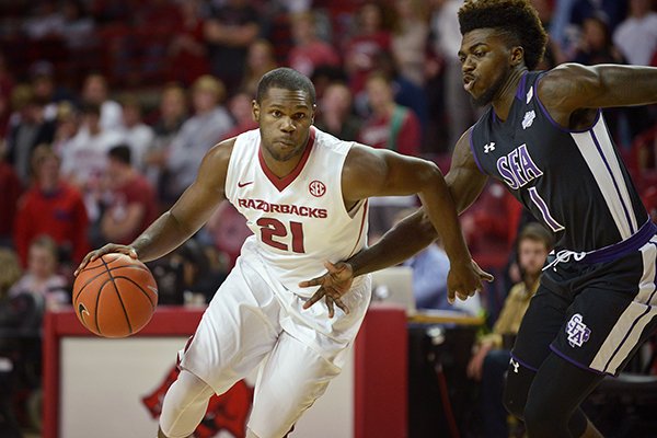 Arkansas' Manny Watkins (21) drives during a game against Stephen F. Austin on Thursday, Dec. 1, 2016, in Fayetteville. 