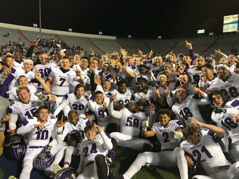 The Fayetteville Bulldogs celebrate winning the 7A state title Friday night at War Memorial Stadium.