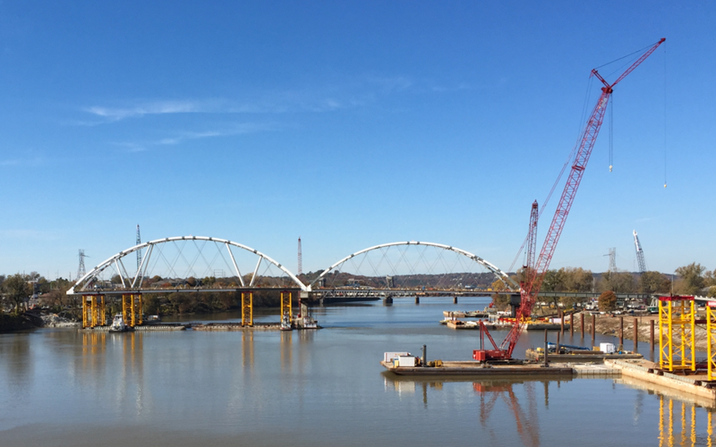 The second arch of the new Broadway Bridge is moved into place Friday morning.
