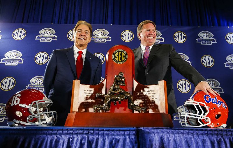 Alabama Coach Nick Saban (left) and Florida Coach Jim McElwain have their respective teams in today’s SEC Championship Game for the ninth time in the 25-year history of the game. The top-ranked Crimson Tide have won 24 games in a row and beat the No. 15 Gators 29-15 in last season’s league title game.