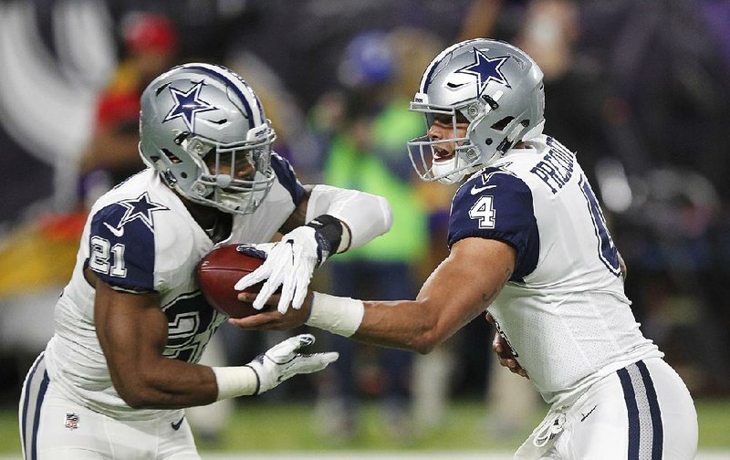 Dallas Cowboys quarterback Dak Prescott (right) hands off to running back Ezekiel Elliott during Thursday’s 17-15 victory over the Minnesota Vikings. Elliott rushed for 86 yards and 1 touchdown on 20 carries, while Prescott had 37 yards on 6 carries and passed for 139 yards and 1 score.