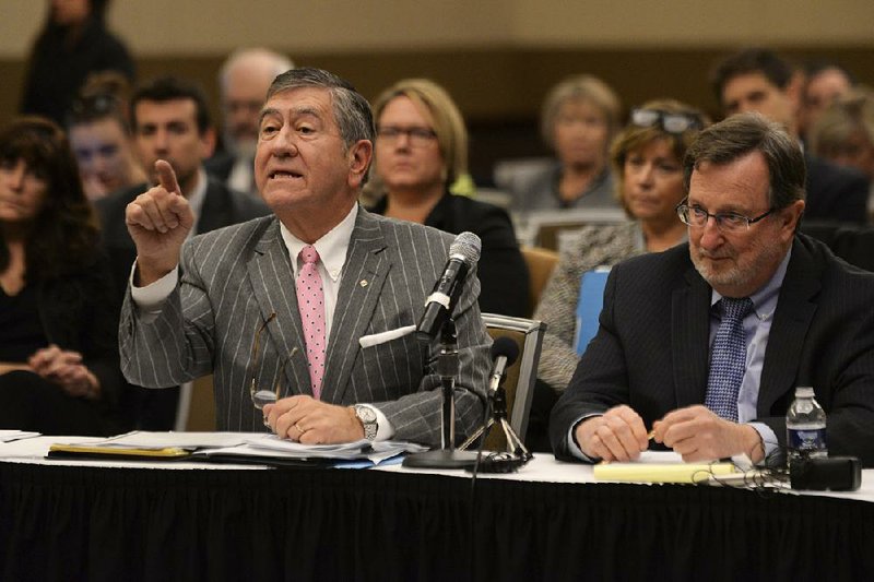 Election attorneys John Pirich (left) and Gary Gordon, representing the Donald Trump campaign, speak before the Michigan Board of State Canvassers on Friday in a bid to avert a recount by the state.