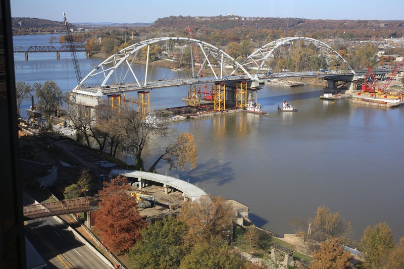 Vessels move around the second arch of the Broadway Bridge after it was guided into place on Dec. 2.