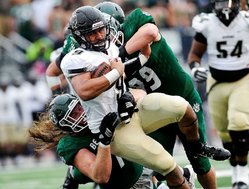 Running back Michael Latu fights for extra yardage for Harding, which got all of its 119 yards of offense against Northwest Missouri State on the ground in its 35-0 loss Saturday in the quarterfinals of the NCAA Division II playoffs.