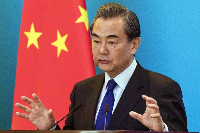 China's Foreign Minister Wang Yi speaks during the opening of the first bilateral working group meeting on the "Belt and Road" with Hungary at the Diaoyutai State Guesthouse, in Beijing, China, Wednesday, Nov. 30, 2016. 