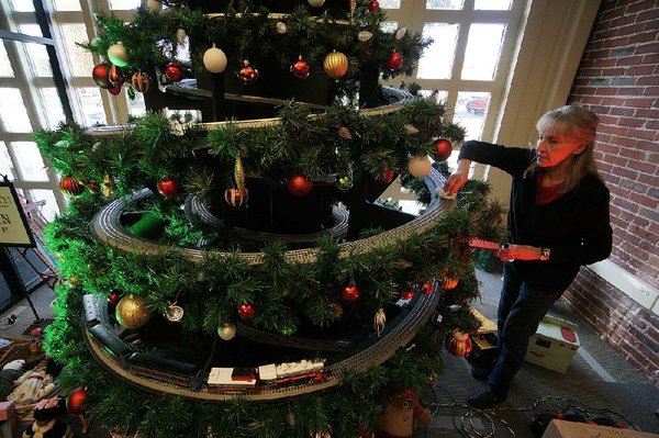 christmas tree with train running through it