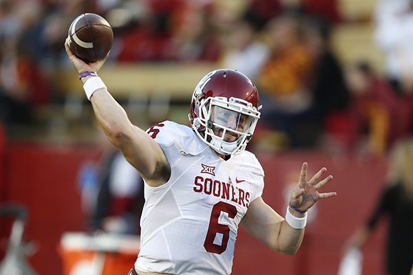 Oklahoma quarterback Baker Mayfield warms up before an NCAA college football game against Iowa State, Thursday, Nov. 3, 2016, in Ames, Iowa. (AP Photo/Charlie Neibergall)
