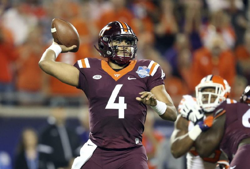 Virginia Tech quarterback Jerod Evans (4) looks to pass, during the first half of the Atlantic Coast Conference championship NCAA college football gam against Virginia Tech, Saturday, Dec. 3, 2016, in Orlando, Fla. (AP Photo/Willie J. Allen Jr.)