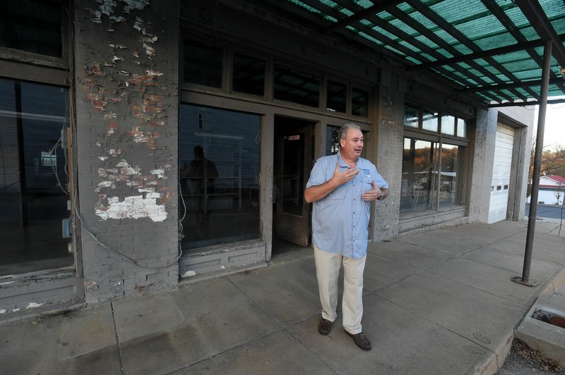 Huntsville Mayor Darrell Trahan takes a look around the old Basham Ford building Tuesday on the northwest corner of the downtown Huntsville square. There is an effort underway to convert the old Basham Ford building into the Madison County museum.