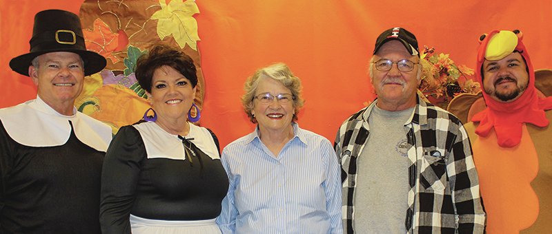 Submitted photo Steve Irwin, left, owner of The Irwin Agency, and staff dressed as pilgrims and turkeys for their annual pumpkin pie giveaway. They gave away more than 200 pies from their "Retirement Education Center" at their office at 307H Carpenter Dam Road. With him are Nancy Baker, clients Ellen and Leroy Varhalla, and Matt Minton. The pies are given away as a token of appreciation for their clients' friendship and business. The Irwin Agency's motto is "Proudly protecting your retirement savings and providing peace of mind since 1989." For more information on how The Irwin Agency can help you with your retirement goals, please call 501-623-7066.