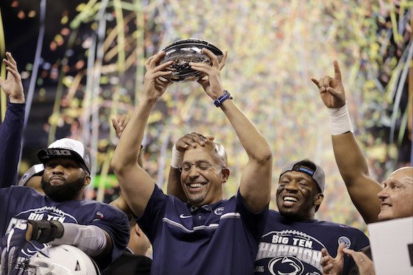 Penn State head coach James Franklin holds the trophy after Penn State won the Big Ten championship NCAA college football game Saturday, Dec. 3, 2016, in Indianapolis. Penn State won 38-31.