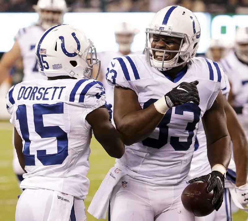 Indianapolis Colts tight end Dwayne Allen (right) celebrates with teammate Phillip Dorsett (15) after scoring a touchdown against the New York Jets on Monday in East Rutherford, N.J. Allen finished with 4 catches for 72 yards and 3 touchdowns.