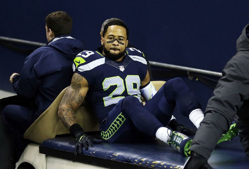 Seattle Seahawks' Earl Thomas leaves the field on a cart after being injured against the Carolina Panthers in the first half of an NFL football game, Sunday, Dec. 4, 2016, in Seattle. 