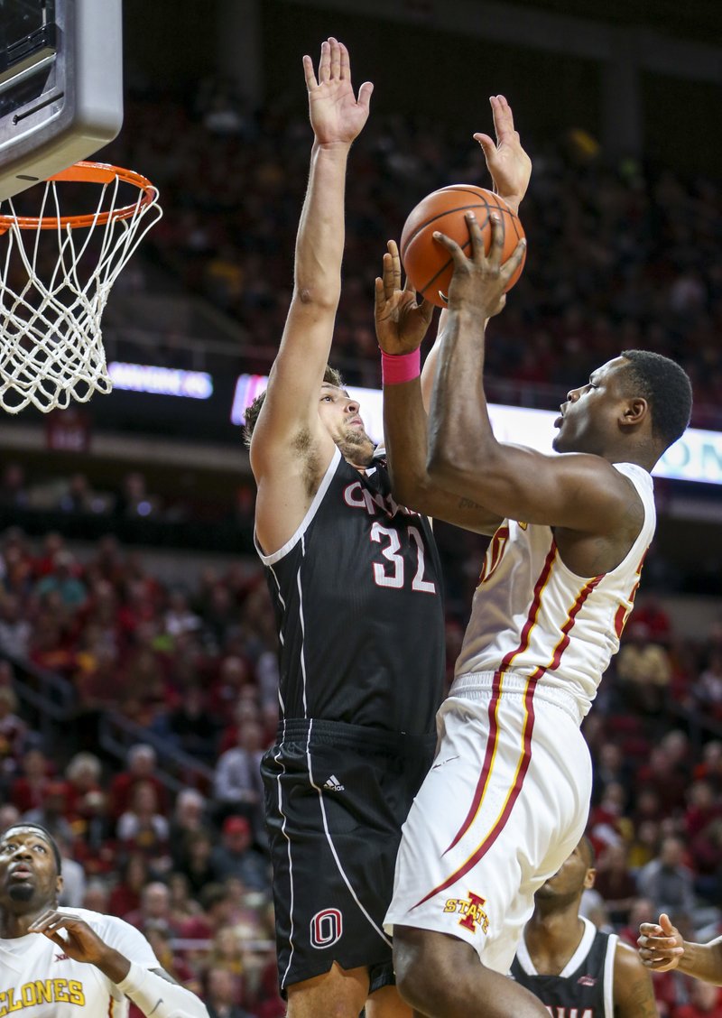 Iowa State guard Deonte Burton puts up a shot over Nebraska-Omaha forward Daniel Meyer during the first half of an NCAA college basketball game, Monday, Dec. 5, 2016, in Ames, Iowa. Burton scored the first 13 points for Iowa State.