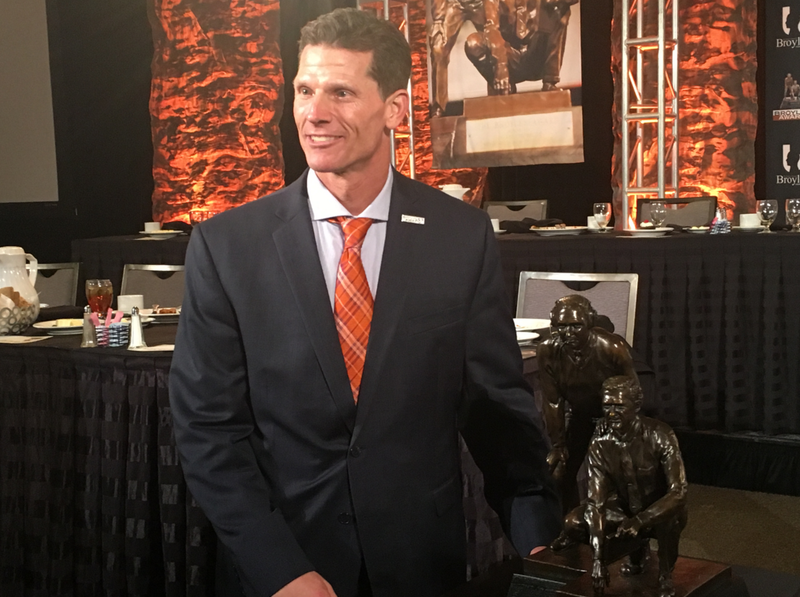 Clemson defensive coordinator Brent Venables poses with the Broyles Award after winning it Tuesday in Little Rock.