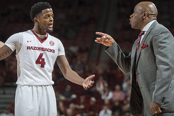 Arkansas coach Mike Anderson gives instructions to Daryl Macon (4) during a game against Houston on Tuesday, Dec. 6, 2016, at Bud Walton Arena in Fayetteville.