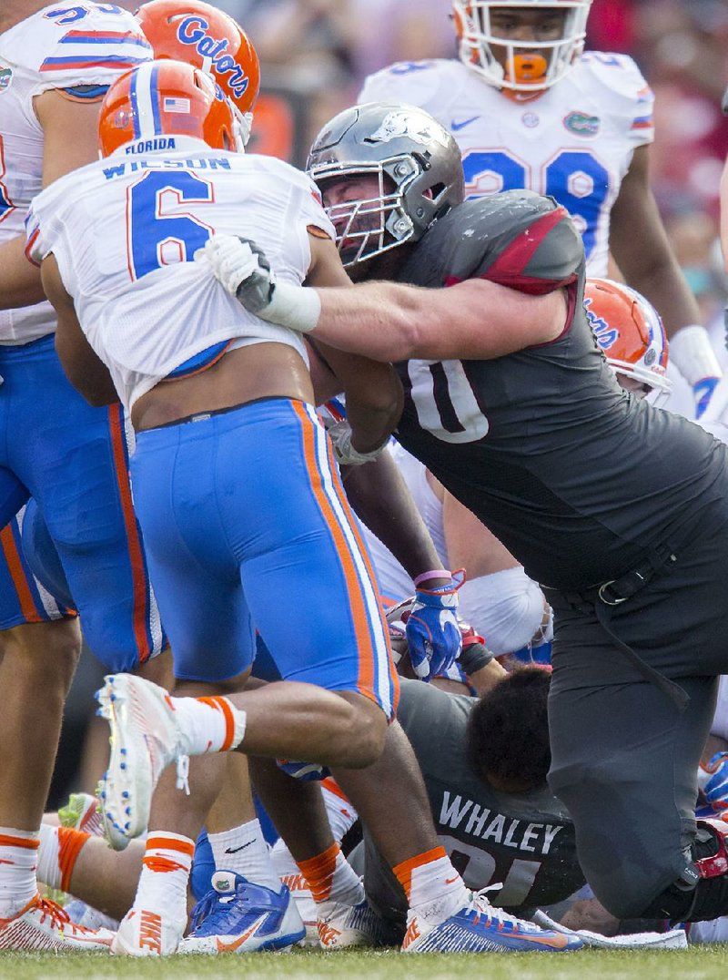 Arkansas senior offensive tackle Dan Skipper (right) blocks Florida defensive back Quincy Wilson during the Razorbacks’ 31-10 victory over the Gators on Nov. 5. On Tuesday, Skipper was named first-team All-SEC by the conference’s coaches. Wilson was named to the second team. 