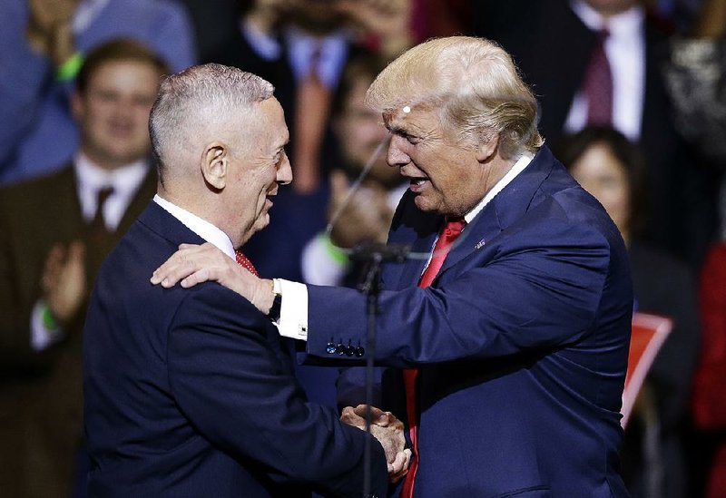 President-elect Donald Trump introduces retired Marine Gen. James Mattis as his official choice for secretary of defense during his “thank you” rally Tuesday in Fayetteville, N.C.