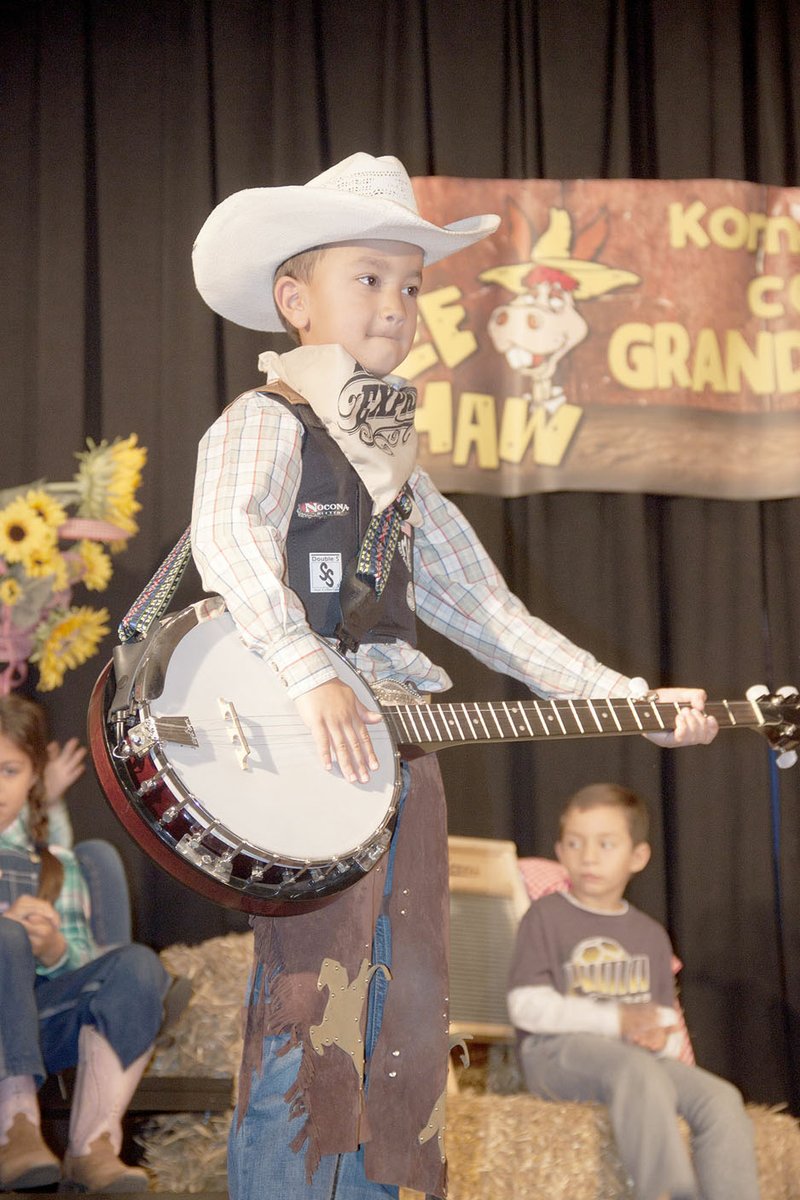LYNN KUTTER ENTERPRISE-LEADER Carter Horton, a second-grader at Williams Elementary, plays the part of Roy Clark from the Hee Haw Show, a popular variety, comedy TV series from 1969-1997. The students presented skits and antics from the show as part of this year&#8217;s Grandparents Day.