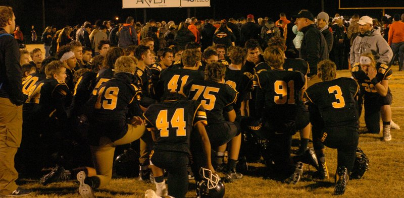 MARK HUMPHREY ENTERPRISE-LEADER Prairie Grove head coach Danny Abshier gives a final talk to the Tiger football team after Friday&#8217;s 48-28 loss to Warren in the state semifinal. The Tigers conclude their year with a 12-1 record, 4A-1 Conference championship and two playoff wins.