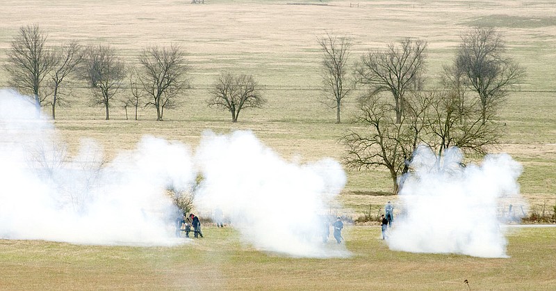 The reenactment of the Battle of Prairie Grove started with shooting between soldiers on horseback and then Union forces shot their cannons toward Confederate troops.