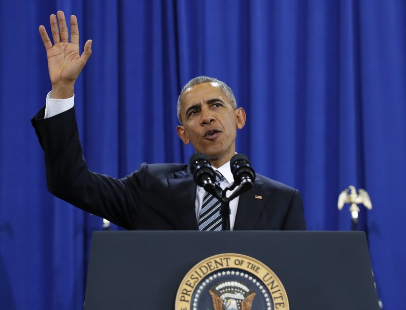 President Barack Obama waves before speaking at MacDill Air Force Base in Tampa, Fla., Tuesday, Dec. 6, 2016, about the administration's approach to counterterrorism campaign. (AP Photo/Carolyn Kaster)