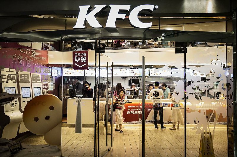 Customers place their orders at the counters inside a Yum China Holdings Inc. KFC restaurant in Shanghai, China, in August. 