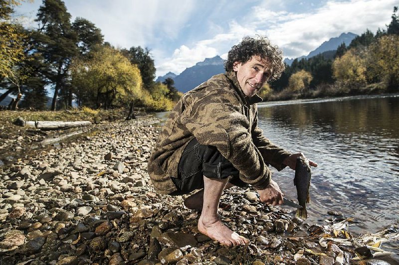 Looking a bit like a Hobbit, participant David Nessia grabs lunch on the new season of History Channel’s survival show, Alone.
