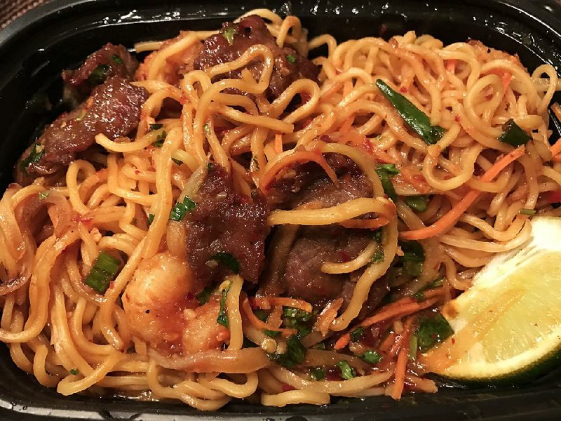The Japanese Steak & Shrimp Chile Ramen (served here as a carryout dish) is one of the new — and very spicy — noodle bowls at Pei Wei at the Promenade at Chenal. 