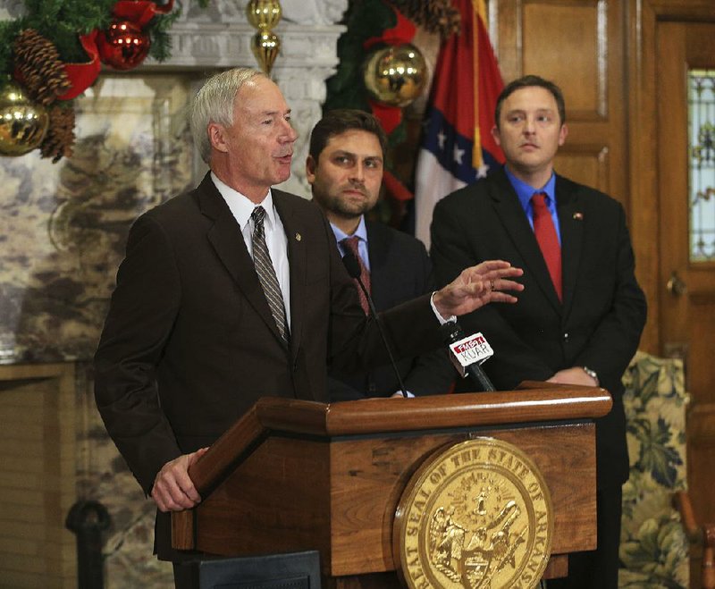 Gov. Asa Hutchinson (from left), Senate Pro Tempore Jonathan Dismang and House Speaker Jeremy Gillam talk Wednesday about their appointments to the new state board that will control who grows and sells medical marijuana in the state. “Licenses are going to be, I suspect, highly sought after, so we want to have a process that has credibility and integrity,” Hutchinson said. 