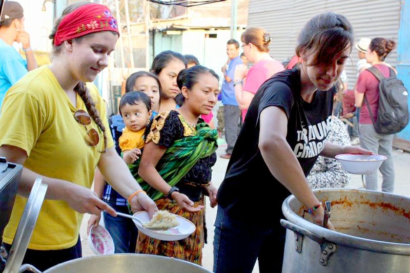 Members of a mission team from Dustin’s Dream and John Brown University in Siloam Springs served food at the Heart of Love Clinic in Guatemala City during a trip in March. Dustin’s Dream annual fundraiser to support continued efforts in Guatemala is planned for Saturday.