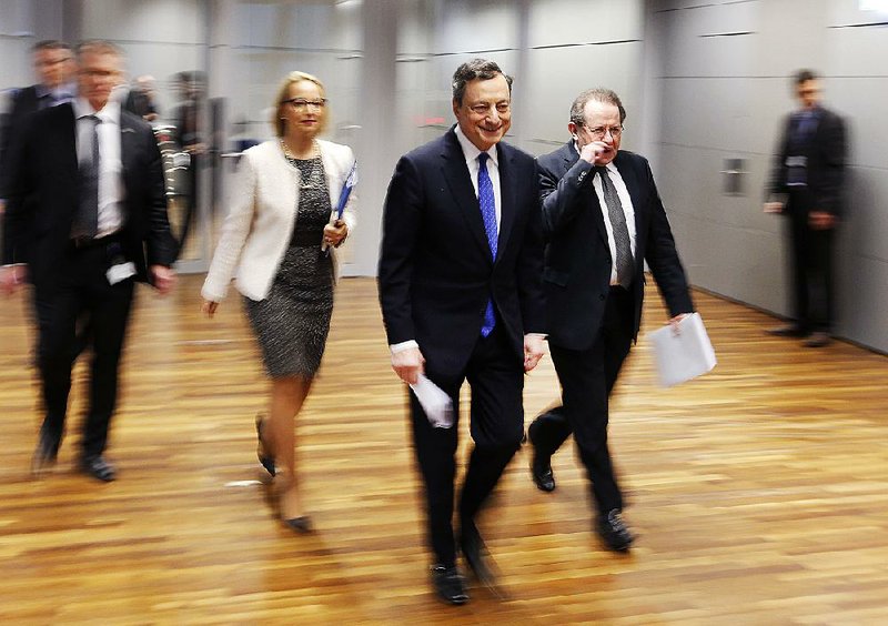 Mario Draghi, president of the European Central Bank, walks to a news conference Thursday in Frankfurt, Germany, after a meeting of the central bank’s governing council. 