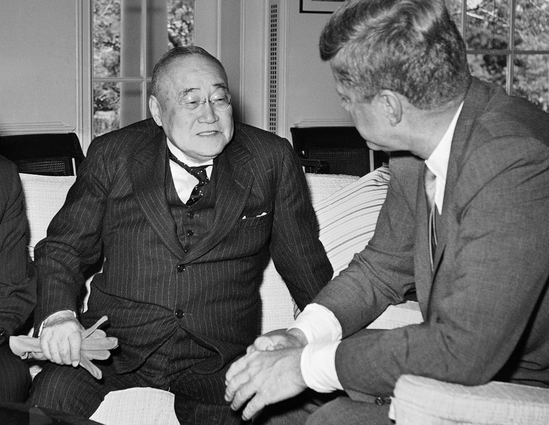 In this May 3, 1962 file photo, U.S. President John F. Kennedy, right, meets with former Japanese Prime Minister Shigeru Yoshida in his White House office in Washington. 