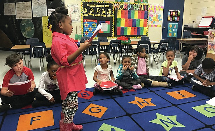 Submitted photo First-grade student Justice Simmons, front, shared her informational writing about wild turkeys to Anna Jackson's class at Langston Aerospace and Environmental Studies Magnet School.