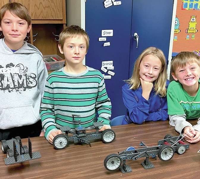 Submitted photo Lakeside Intermediate School students, from left, Caleb Cotton, Eddie Kennedy, Madison Suggs and Aiden Dean explored energy conversion with Vex Robotics during an activity in Erin Ault's fourth-grade Project Lead the Way course.