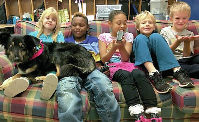 Submitted photo Second- and third-grade students, from left, Lyla Scales, LeBrian Jordan, Annalisa Hardin, Cole Jones and Aiden Hurrell celebrate with Bailey the dog and display the simple machines they created during a Project Lead the Way lesson in Erin Ault's class at Lakeside Intermediate School.