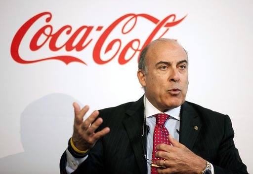 In this May 8, 2013 file photo, Coca-Cola CEO Muhtar Kent speaks during a news conference in Atlanta. Coca-Cola said Friday, Dec. 9, 2016 that Kent will step down as CEO next year and be replaced by Chief Operating Officer James Quincey. 