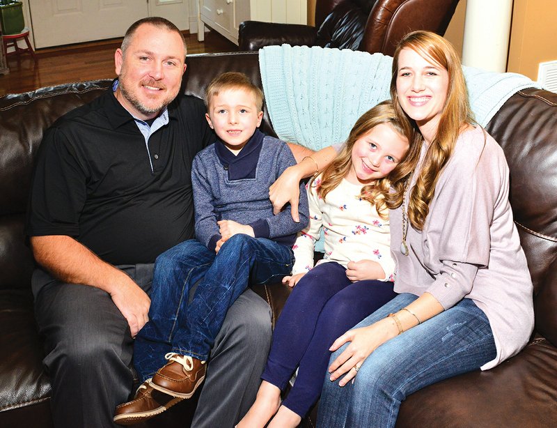 From left, Scott Daily sits with his son, Conor, 7; his daughter, Kasyn, 6; and his wife, Roxanne, who for the majority of the year has managed a fundraising campaign for Conor, who has autism, to have a service dog. Earlier this month, the Daily family reached its $25,000 goal, and in six to eight months, Conor will receive a dog from Service Dogs of Warren Retrievers.