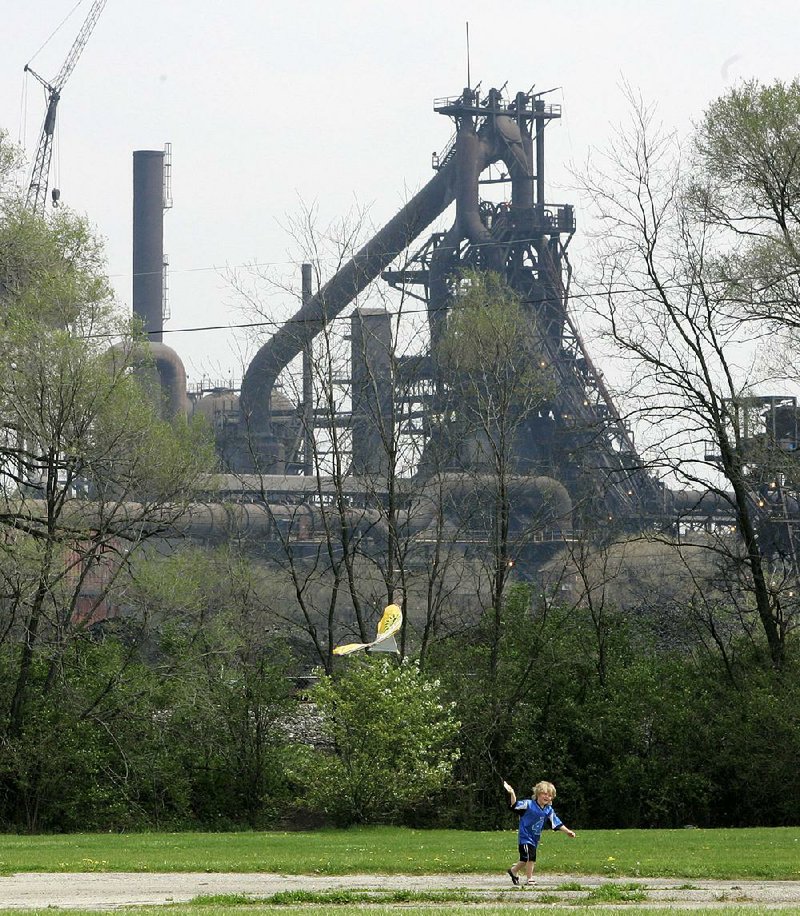 A child flies a kite near AK Steel’s Middletown Works plant in Middletown, Ohio. J.D. Vance’s Hillbilly Elegy: A Memoir of a Family and Culture in Crisis offers a vivid tour of the stark world Vance grew up in.