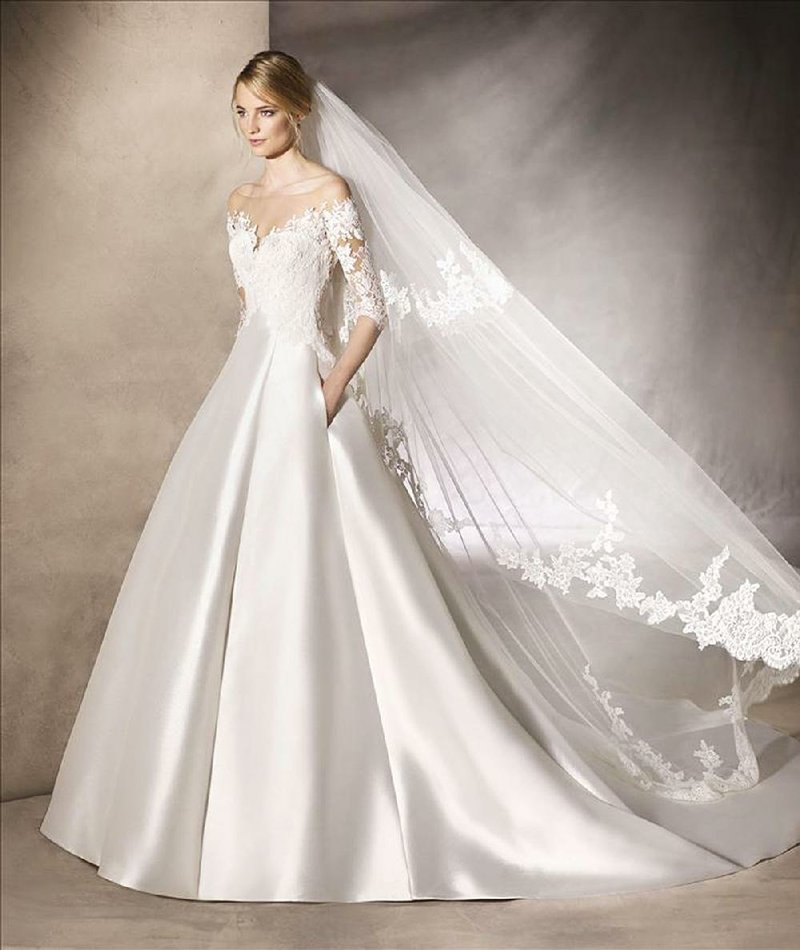 The Haland bridal gown, part of the La Sposa Collection, refl ects the current trend in bridalwear: Sleeves — a step away from the strapless looks that have been dominating wedding gowns. The gown is available at Proposals in Little Rock.