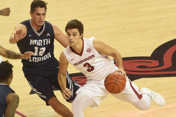 Arkansas' Dusty Hannahs drives in the first half of the Razorbacks' 91-76 win over North Florida.